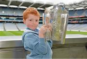 7 September 2013; On the eve of the All-Ireland Hurling Final, Clare hurling legend Jamesie O’Connor gave a unique tour of Croke Park stadium as part of the Bord Gáis Energy Legends Tour Series. Pictured holding the Liam MacCarthy Cup at the tour is Tommy McNamara, aged 7, from Ennis, Co. Clare. The Final Bord Gáis Energy Legends Tour of the year will take place on Saturday, 21st September and will feature former Mayo player, Willie Joe Padden. Full details are available on www.crokepark.ie/events. Croke Park, Dublin. Picture credit: Barry Cregg / SPORTSFILE