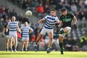 29 October 2023; Barry O'Driscoll of Nemo Rangers gets his shot away despite the best efforts of Mark Collins of Castlehaven during the Cork County Premier Senior Club Football Championship final match between Castlehaven and Nemo Rangers at Páirc Uí Chaoimh in Cork. Photo by Brendan Moran/Sportsfile