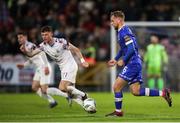 4 November 2023; Rowan McDonald of Waterford in action against Mikie Rowe of Cobh Ramblers during the SSE Airtricity Men's First Division Play-Off Final between Waterford and Cobh Ramblers at Turner's Cross in Cork. Photo by Michael P Ryan/Sportsfile