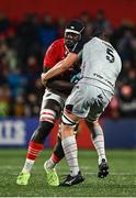 4 November 2023; Edwin Edogbo of Munster is tackled by Ryan Woodman of Dragons during the United Rugby Championship match between Munster and Dragons at Musgrave Park in Cork. Photo by Eóin Noonan/Sportsfile