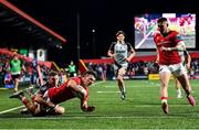 4 November 2023; Calvin Nash of Munster scores a try under pressure from Dane Blacker of Dragons during the United Rugby Championship match between Munster and Dragons at Musgrave Park in Cork. Photo by Piaras Ó Mídheach/Sportsfile