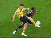 12 November 2023; Jonathan Afolabi of Bohemians in action against Joe Redmond of St Patrick's Athletic during the Sports Direct FAI Cup Final between Bohemians and St Patrick's Athletic at the Aviva Stadium in Dublin. Photo by Michael P Ryan/Sportsfile