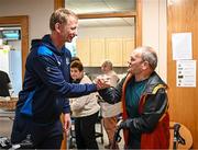 17 November 2023; As part of Leinster Rugby's charity partnership with St Michael’s House, Head Coach Leo Cullen visited their care centre in Ballymun today. St Michael’s House provides a comprehensive range of services and supports to men, women and children with intellectual disabilities and their families in 170 locations in the greater Dublin area. It supports around 2,300 people and this has an impact on thousands of family members. St Michael’s House was introduced to Leinster Rugby by Aircoach, one of their partners. Pictured at the event Leinster head coach Leo Cullen meets service user Joe Carolyn at St Michael’s House in Dublin. Photo by Harry Murphy/Sportsfile