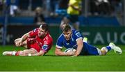 18 November 2023; Garry Ringrose of Leinster dives over to score his side's fourth try during the United Rugby Championship match between Leinster and Scarlets at the RDS Arena in Dublin. Photo by Harry Murphy/Sportsfile