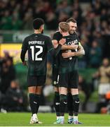 21 November 2023; James McClean of Republic of Ireland with teammates Shane Duffy and Andrew Omobamidele as he prepares to leave the field for a substitution during the international friendly match between Republic of Ireland and New Zealand at the Aviva Stadium in Dublin. Photo by Michael P Ryan/Sportsfile