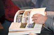 24 November 2023; Guests flick through the book at the launch of the Allianz Cumann na mBunscol 50th anniversary book, &quot;50 Bliain ag Fás’, at Croke Park in Dublin. Photo by Sam Barnes/Sportsfile