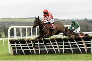 25 November 2023; Mighty Bandit, with Jack Kennedy up, jump the last on their way to winning the John Lynch Carpets 3 Year Old Maiden Hurdle on day one of the Punchestown Winter Festival at Punchestown Racecourse in Kildare. Photo by Matt Browne/Sportsfile