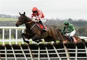 25 November 2023; Mighty Bandit, with Jack Kennedy up, jump the last on their way to winning the John Lynch Carpets 3 Year Old Maiden Hurdle on day one of the Punchestown Winter Festival at Punchestown Racecourse in Kildare. Photo by Matt Browne/Sportsfile