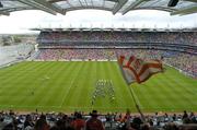 11 July 2004; An Armagh fan waves a flag as the National Anthem finishes. Bank of Ireland Ulster Senior Football Championship Final, Armagh v Donegal, Croke Park, Dublin. Picture credit; Brian Lawless / SPORTSFILE