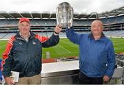 7 September 2013; On the eve of the All-Ireland Hurling Final, Clare hurling legend Jamesie O’Connor gave a unique tour of Croke Park stadium as part of the Bord Gáis Energy Legends Tour Series. Pictured holding the Liam MacCarthy Cup at the tour are Liam Condon, left, and John O'Shea, from Bandon, Co. Cork. The Final Bord Gáis Energy Legends Tour of the year will take place on Saturday, 21st September and will feature former Mayo player, Willie Joe Padden. Full details are available on www.crokepark.ie/events. Croke Park, Dublin. Picture credit: Barry Cregg / SPORTSFILE
