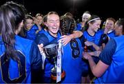 7 December 2023; UCD captain Ciara Lawlor celebrates with the cup and teammate Aíne Loughman, 8, after the 3rd Level Ladies Football League Division 2 final match between UCD and Ulster University at Dundalk Institute of Technology in Dundalk, Louth. Photo by Ben McShane/Sportsfile