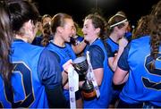 7 December 2023; UCD captain Ciara Lawlor celebrates with the cup and teammate Aíne Loughman, right, after the 3rd Level Ladies Football League Division 2 final match between UCD and Ulster University at Dundalk Institute of Technology in Dundalk, Louth. Photo by Ben McShane/Sportsfile