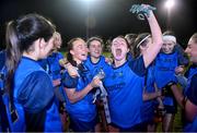 7 December 2023; UCD players Ciara Lawlor, Jane Duffy and Aíne Loughman celebrate with the cup after the 3rd Level Ladies Football League Division 2 final match between UCD and Ulster University at Dundalk Institute of Technology in Dundalk, Louth. Photo by Ben McShane/Sportsfile