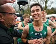 10 December 2023; Jonas Stafford of Ireland celebrates after Ireland won team gold in the U20 men's 5000m during the SPAR European Cross Country Championships at Laeken Park in Brussels, Belgium. Photo by Sam Barnes/Sportsfile