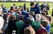 10 December 2023; As part of the club’s 12 County Tour, Leinster Rugby players Jack Conan and Ross Byrne visited Roscrea RFC for their minis’ Christmas Party. Pictured is Ross Byrne signing supporters' jerseys at Roscrea RFC in Tipperary. Photo by Tyler Miller/Sportsfile