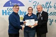 14 December 2023; Caherlistrane, Galway, representative Claire Kane is presented their Foundation Healthy Club award by Connacht GAA secretary John Prenty, left, and Connacht GAA Council president John Murphy, right, during the Irish Life Connacht GAA Healthy Clubs recognition event at the Connacht GAA Centre of Excellence in Bekan, Mayo. Photo by Ben McShane/Sportsfile