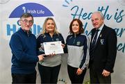 14 December 2023; Tynagh Abbey Duniry, Galway, representatives Deirdre Donnelly and Orlah Fahy is presented their Gold Healthy Club award by Connacht GAA secretary John Prenty, left, and Connacht GAA Council president John Murphy, right, during the Irish Life Connacht GAA Healthy Clubs recognition event at the Connacht GAA Centre of Excellence in Bekan, Mayo. Photo by Ben McShane/Sportsfile