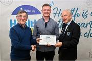 14 December 2023; Bornacoola, Leitrim, representative Allan Croghan is presented their Foundation Healthy Club award by Connacht GAA secretary John Prenty, left, and Connacht GAA Council president John Murphy, right, during the Irish Life Connacht GAA Healthy Clubs recognition event at the Connacht GAA Centre of Excellence in Bekan, Mayo. Photo by Ben McShane/Sportsfile