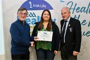 14 December 2023; Gortletteragh, Leitrim, representative Aoife Keenan is presented their Foundation Healthy Club award by Connacht GAA secretary John Prenty, left, and Connacht GAA Council president John Murphy, right, during the Irish Life Connacht GAA Healthy Clubs recognition event at the Connacht GAA Centre of Excellence in Bekan, Mayo. Photo by Ben McShane/Sportsfile