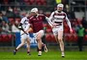 3 December 2023; Paddy Burke of Ruairí Óg and Jack Cassidy of Slaughtneil during the AIB Ulster GAA Hurling Senior Club Championship final match between Ruairi Óg, Antrim, and Slaughtneil, Derry, at Páirc Esler in Newry, Down. Photo by Ben McShane/Sportsfile