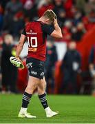 9 December 2023; Jack Crowley of Munster reacts, while carrying his missing boot, after the final whistle of the Investec Champions Cup Pool 3 Round 1 match between Munster and Aviron Bayonnais at Thomond Park in Limerick. Photo by Brendan Moran/Sportsfile