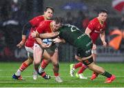 1 January 2024; Scott Buckley of Munster is tackled by Conor Oliver of Connacht during the United Rugby Championship match between Connacht and Munster at The Sportsground in Galway. Photo by Seb Daly/Sportsfile