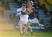 6 January 2024; Liam Coleman of Wexford in action against Alex Beirne of Kildare during the Dioralyte O'Byrne Cup quarter-final match between Wexford and Kildare at Chadwicks Wexford Park in Wexford. Photo by Sam Barnes/Sportsfile