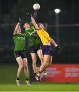 9 January 2024; Rory Donnelly, centre, supported by Queens teammate Joe McDaid, competes for a high ball with Shane Walsh of DCU during the Electric Ireland Higher Education GAA Sigerson Cup Round 1 match between Queens University Belfast and DCU at The Dub at Queen’s Sport in Belfast. Photo by Ramsey Cardy/Sportsfile