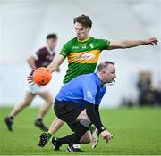 12 January 2024; Darragh Rooney of Leitrim takes a shot for a point as referee Paul Lydon ducks out of the way during the Connacht FBD League semi-final match between Leitrim and Galway at University of Galway Connacht GAA AirDome in Bekan, Mayo. Photo by Piaras Ó Mídheach/Sportsfile