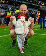14 January 2024; Kieran Hoey of St Patrick's Cullyhanna celebrates with his daughter Sophie, aged 14 months, the AIB GAA Football All-Ireland Intermediate Club Championship final match between Cill na Martra of Cork and St Patrick's Cullyhanna of Armagh at Croke Park in Dublin. Photo by Ben McShane/Sportsfile