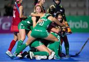 16 January 2024; Sarah Hawkshaw of Ireland, hidden, celebrates with teammates after scoring her side's first goal during the FIH Women's Olympic Hockey Qualifying Tournament Pool A match between Ireland and Korea Republic at Campo de Hockey Hierba Tarongers in Valencia, Spain. Photo by Manuel Queimadelos/Sportsfile