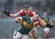 20 January 2024; Graham O’Sullivan of Kerry in action against Ian Maguire of Cork during the McGrath Cup final match between Kerry and Cork at Páirc Ui Rinn in Cork. Photo by Michael P Ryan/Sportsfile