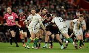 20 January 2024; Alex Nankivell of Munster is tackled by Alex Mitchell and Rory Hutchinson of Northampton Saints during the Investec Champions Cup Pool 3 Round 4 match between Munster and Northampton Saints at Thomond Park in Limerick. Photo by Brendan Moran/Sportsfile