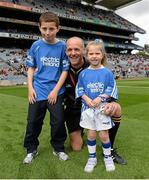 8 September 2013; Eric Tuohy, from Galway, age 11, and Brooke O'Regan, age 6, from Waterford, are pictured at the Electric Ireland GAA Hurling All-Ireland Minor Championship Final where they were the official ball-carriers and had the honour of presenting the match sliotar to referee Cathal McAllister before the game. William and Joe won their prizes through Electric Ireland’s Facebook page www.facebook.com/ElectricIreland. Electric Ireland GAA Hurling All-Ireland Minor Championship Final, Galway v Waterford, Croke Park, Dublin. Picture credit: Matt Browne / SPORTSFILE