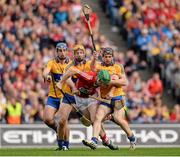 8 September 2013; Séamus Harnedy, Cork, is tackled by Clare players, from left, Conor Ryan, Cian Dillon and Brendan Bugler, resulting in a penalty. GAA Hurling All-Ireland Senior Championship Final, Cork v Clare, Croke Park, Dublin. Picture credit: Stephen McCarthy / SPORTSFILE
