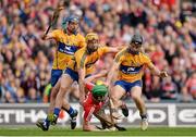 8 September 2013; Séamus Harnedy, Cork, is tackled by Clare players, from left, Conor Ryan, Cian Dillon and Brendan Bugler, resulting in a penalty. GAA Hurling All-Ireland Senior Championship Final, Cork v Clare, Croke Park, Dublin. Picture credit: Stephen McCarthy / SPORTSFILE