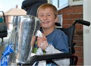 9 September 2013; Keenan Fitzpatrick, age 8, from Gorey, Co. Wexford, holds the Irish Press Cup during a visit by the All-Ireland Minor Hurling Champions Waterford to Our Lady's Hospital for Sick Children, Crumlin. Picture credit: Barry Cregg / SPORTSFILE