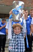 9 September 2013; Jack Mulhall, age 5, from Clonoulty, Cashel, Co. Tipperary, holds the Irish Press Cup during a visit by the All-Ireland Minor Hurling Champions Waterford to Our Lady's Hospital for Sick Children, Crumlin. Picture credit: Barry Cregg / SPORTSFILE