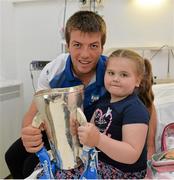 9 September 2013; Waterford captain Kevin Daly with Morgan McCann, age 5 from Tallaght, Dublin  and the Irish Press Cup on a visit by the All-Ireland Minor Hurling Champions to Our Lady's Hospital for Sick Children, Crumlin. Picture credit: Barry Cregg / SPORTSFILE