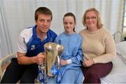 9 September 2013; Caoimhe Earls, aged 13, from Abbeyleix, Co. Laois, holds the Irish Press cup with Waterford captain Kevin Daly and her mother Trudy on a visit by the All-Ireland Minor Hurling Champions to Our Lady's Hospital for Sick Children, Crumlin. Picture credit: Barry Cregg / SPORTSFILE