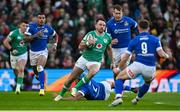 11 February 2024; Hugo Keenan of Ireland evades the tackle of Gianmarco Lucchesi of Italy during the Guinness Six Nations Rugby Championship match between Ireland and Italy at the Aviva Stadium in Dublin. Photo by Brendan Moran/Sportsfile
