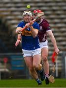 11 February 2024; Seán Ryan of Tipperary fires in a shot, under pressure from TJ Brennan of Galway, during the Allianz Hurling League Division 1 Group B match between Tipperary and Galway at FBD Semple Stadium in Thurles, Tipperary. Photo by Ray McManus/Sportsfile