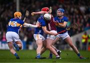 11 February 2024; Ronan Glennon of Galway is tackled by Galway players Tom Monaghan, left, Evan Niland and Jason Flynn during the Allianz Hurling League Division 1 Group B match between Tipperary and Galway at FBD Semple Stadium in Thurles, Tipperary. Photo by Ray McManus/Sportsfile