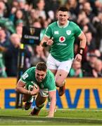 11 February 2024; Jack Crowley of Ireland scores his side's first try during the Guinness Six Nations Rugby Championship match between Ireland and Italy at the Aviva Stadium in Dublin. Photo by Ben McShane/Sportsfile