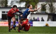 15 February 2024; Sadhbh Furlong of Leinster is tackled by Munster players Emma Dunican, left, and Niamh Crotty during the U18 Girls Interprovincial semi-final match between Leinster and Munster at Terenure College RFC in Dublin. Photo by Shauna Clinton/Sportsfile