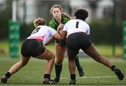 15 February 2024; Uillin Eilian of Connacht is tackled by Ulster players Cara McLean, left, and Grace Simati during the U18 Girls Interprovincial semi-final match between Ulster and Connacht at Terenure College RFC in Dublin. Photo by Seb Daly/Sportsfile