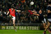 17 February 2024; Bob Tuohy of Mayo kicks a point despite the efforts of Joe O'Connor of Kerry during the Allianz Football League Division 1 match between Kerry and Mayo at Austin Stack Park in Tralee, Kerry. Photo by Brendan Moran/Sportsfile