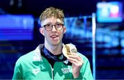 18 February 2024; Daniel Wiffen of Ireland with his gold medal after winning the Men's 1500m freestyle final during day eight of the World Aquatics Championships 2024 at the Aspire Dome in Doha, Qatar. Photo by Ian MacNicol/Sportsfile