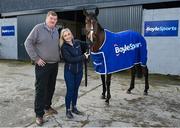 26 February 2024; BoyleSports has announced it is teaming up with John ‘Shark’ Hanlon as his Official Stable Partner. The new multi-year partnership will see the bookmaker gain exclusive access to follow horse racing hero Hewick on his journey to the Cheltenham Gold Cup as well as a host of other big feature races throughout 2024/2025. To mark the 100th year of the Cheltenham Gold Cup, BoyleSports has also pledged to donate €100,000 to the Irish Injured Jockeys (IIJ) and the Inured Jockey’s Fund (IJF) if Hewick wins the race. Pictured is horse trainer John ‘Shark’ Hanlon, with BoyleSports head of PR and Sponsorship Sharon McHugh, and Hewick, at his yard in Fenniscourt, Carlow. Photo by Seb Daly/Sportsfile