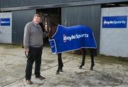 26 February 2024; BoyleSports has announced it is teaming up with John ‘Shark’ Hanlon as his Official Stable Partner. The new multi-year partnership will see the bookmaker gain exclusive access to follow horse racing hero Hewick on his journey to the Cheltenham Gold Cup as well as a host of other big feature races throughout 2024/2025. To mark the 100th year of the Cheltenham Gold Cup, BoyleSports has also pledged to donate €100,000 to the Irish Injured Jockeys (IIJ) and the Inured Jockey’s Fund (IJF) if Hewick wins the race. Pictured is horse trainer John ‘Shark’ Hanlon, and Hewick, at his yard in Fenniscourt, Carlow. Photo by Seb Daly/Sportsfile